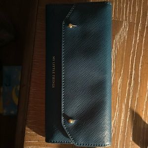 anthropologie “my little things wallet”. Brand new. Never been used.